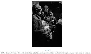 People surrounding mother and baby