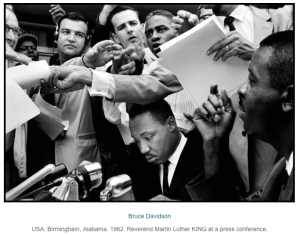 Dr. martin luther king jr. surrounded by reporters