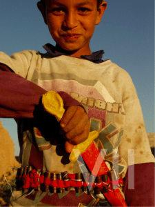 Iraqi child with fake knife.