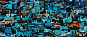 Blue city rooftops and building sides