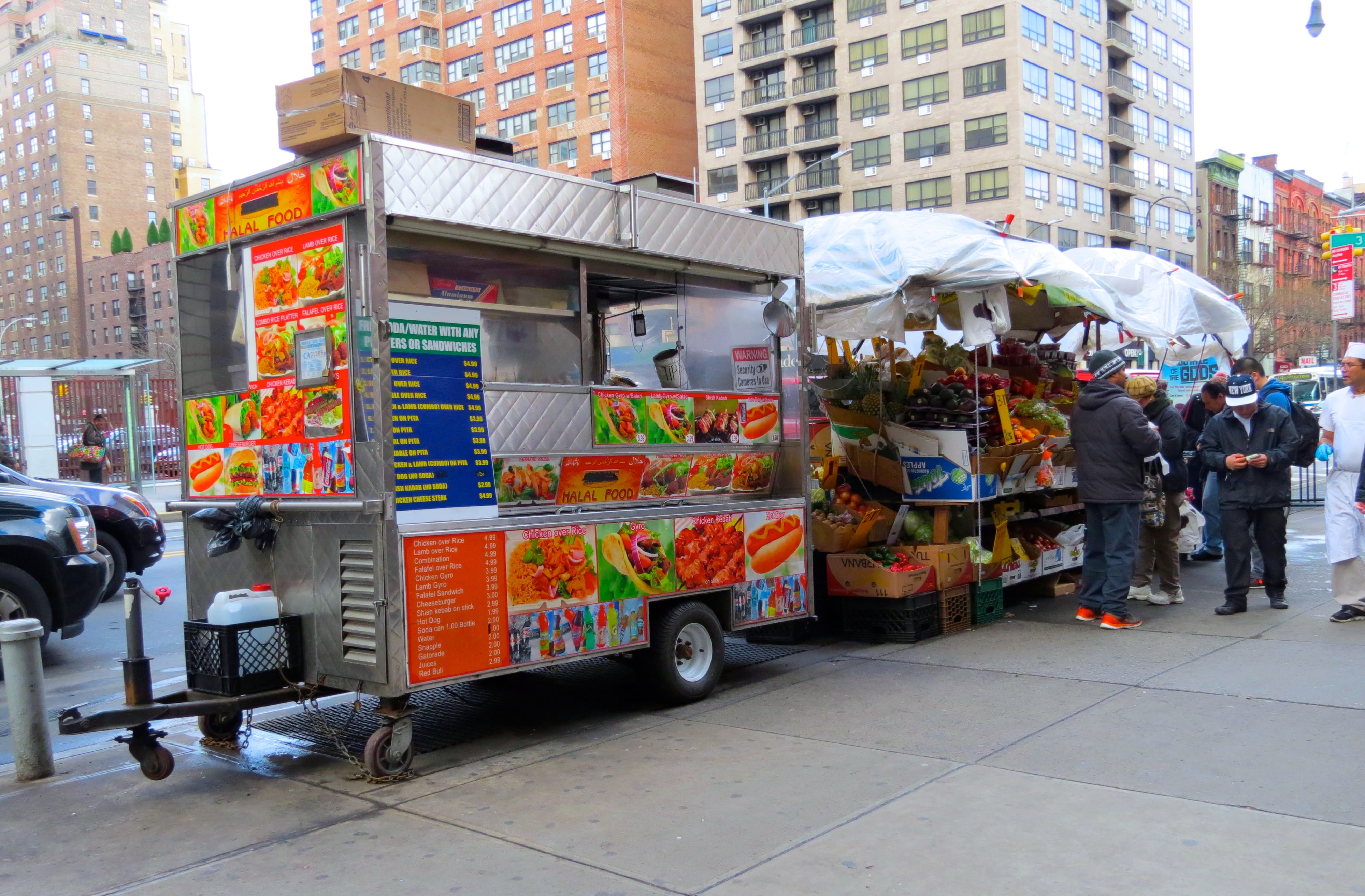 Halal truck next to fruit stand in New york city