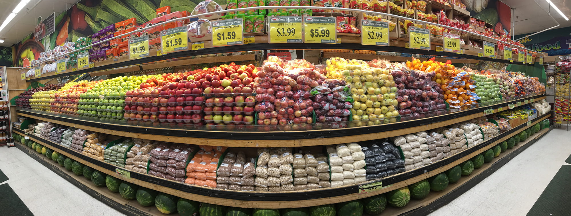 Different colored apples sorted in supermarket produce section