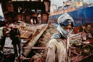 Boy with head tied and goggles pushed up onto his forehead