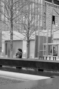 woman in front of memorial fountain