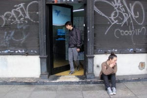 man coming out of a building