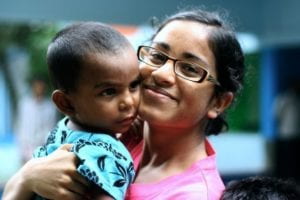 the author holding a toddler