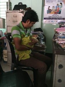 man with baby in office