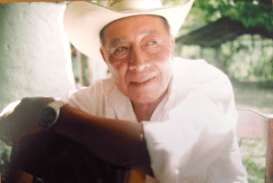 man posing in cowboy hat