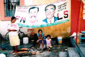 Family in front of poster advertising FNLS