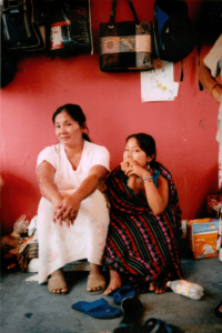 two women sitting in a room