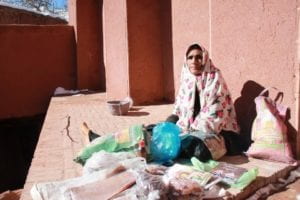 Iranian women sitting on the ground outside