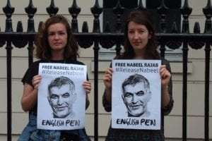 the author and Baggot holding protest signs