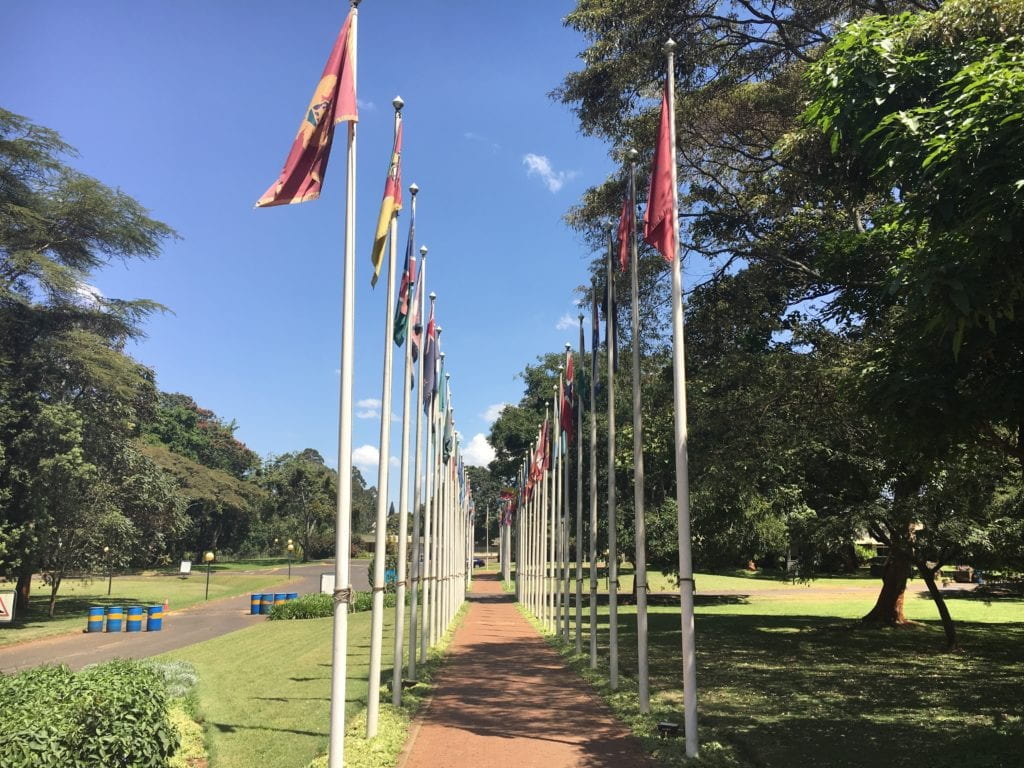 Walkway with tall flags from around the world 