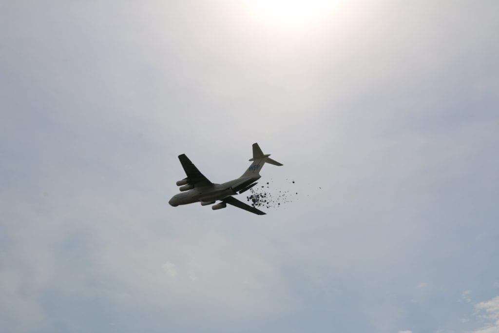 Plane air dropping supplies 