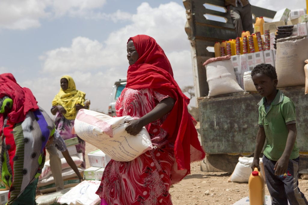 Somalis redeeming their Cash-Based Transfers (CBTs) for food rations.