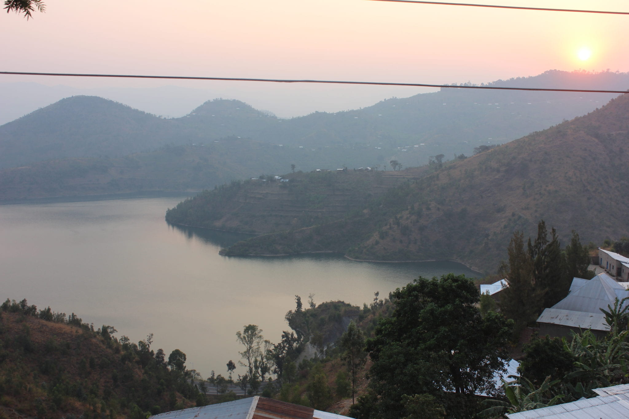 large lake with mountains in the background at sunset