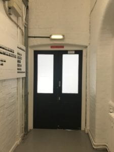 doors at the end of a hallway