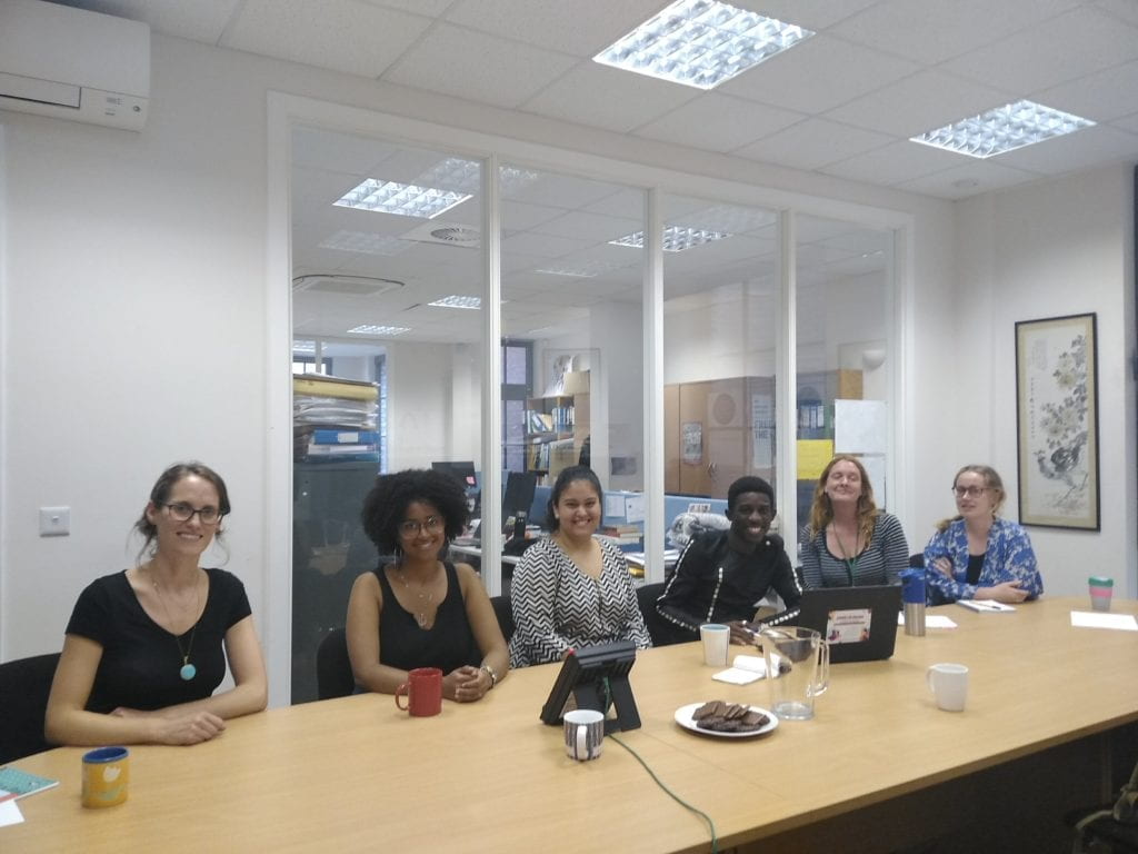 the author and five people in a conference room