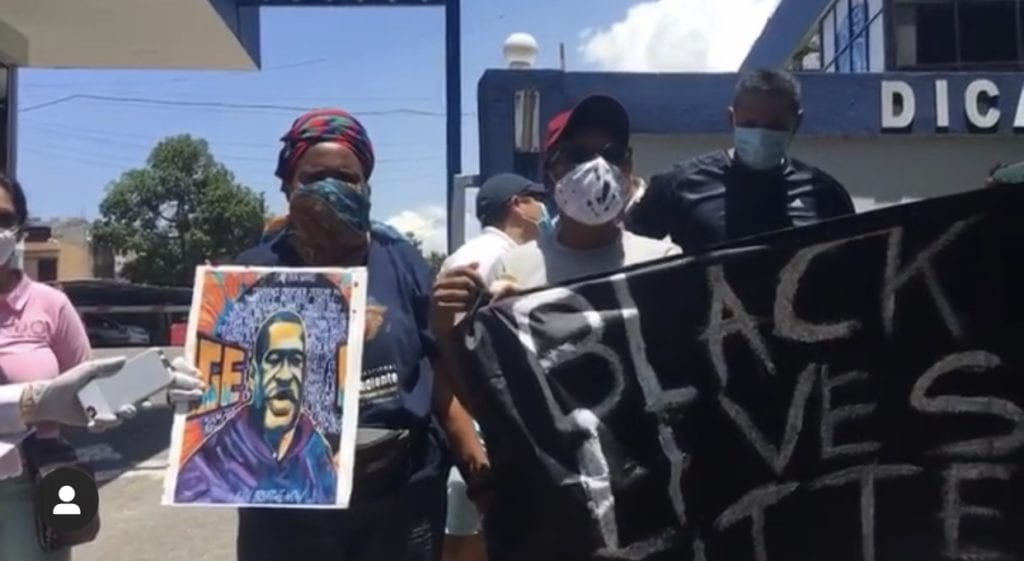 people holding "black lives matter" sign